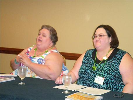 Image: Two women at table answering questions.